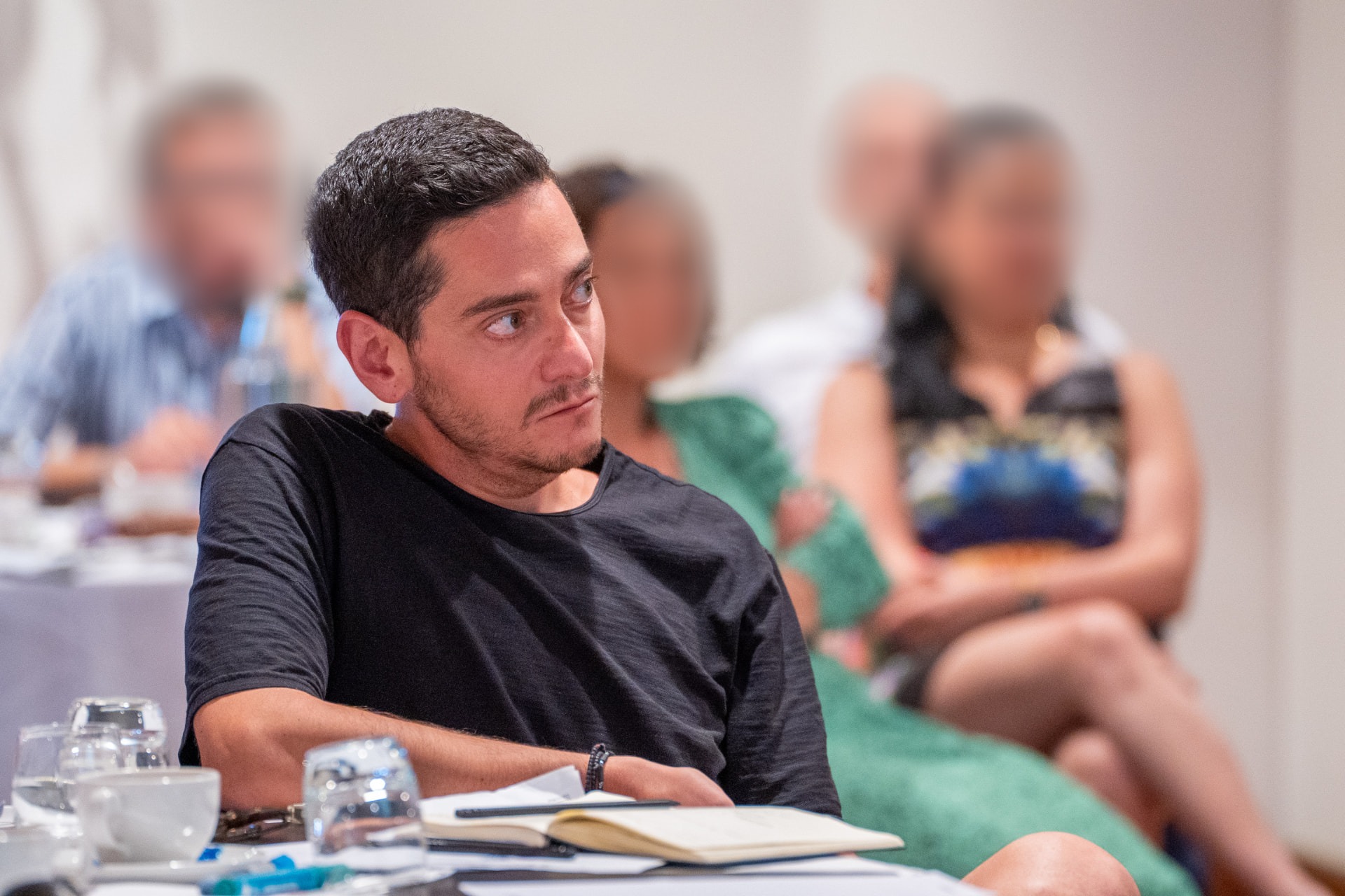 Theo listening during a workshop