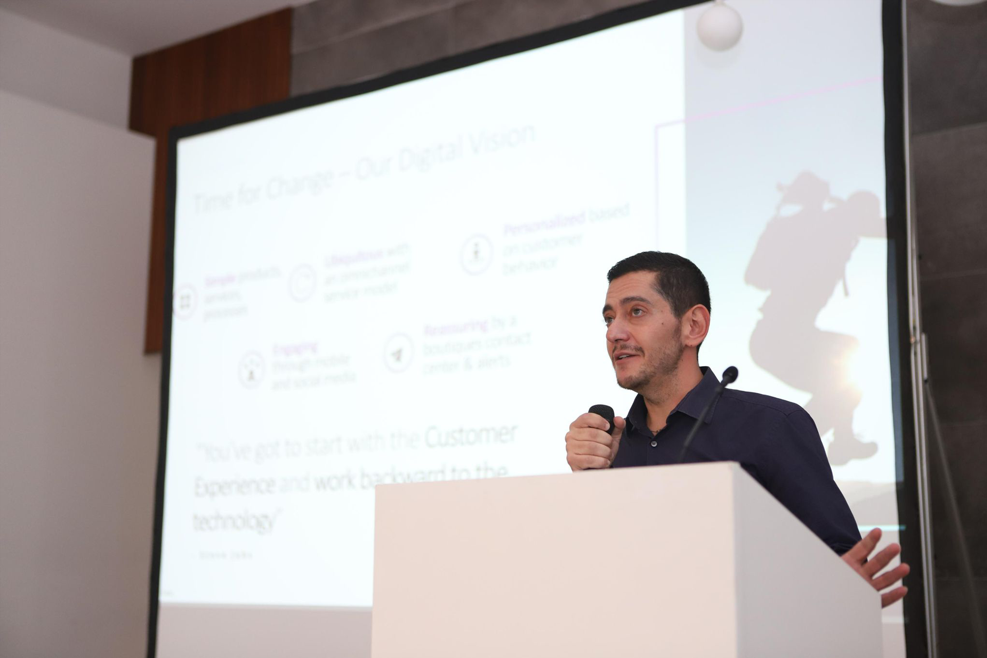 Theo presenting at a podium